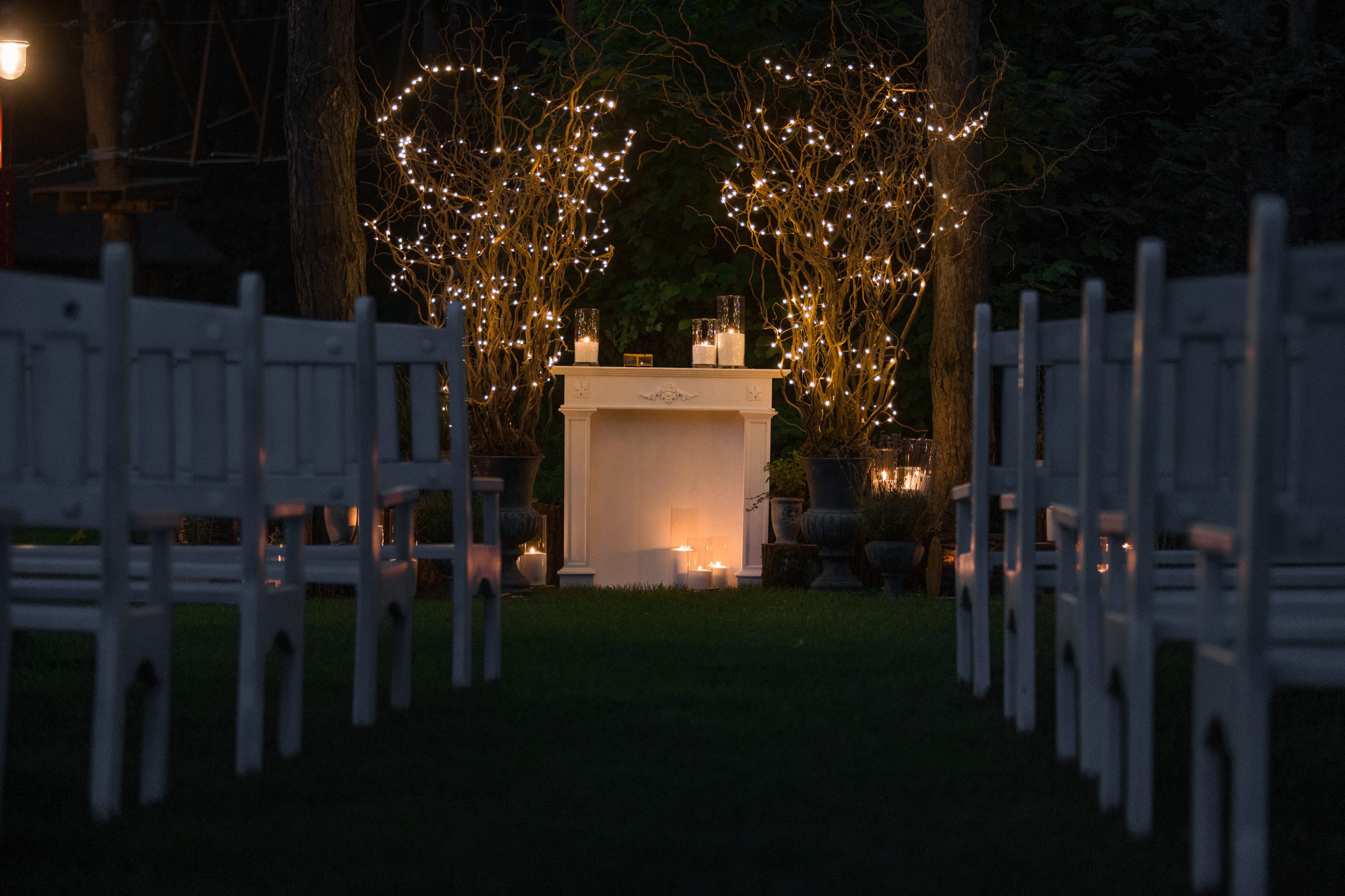 place for wedding altar made of cosy fireplace and candles